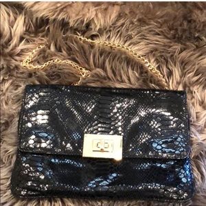 Michael Kira black python embossed clutch